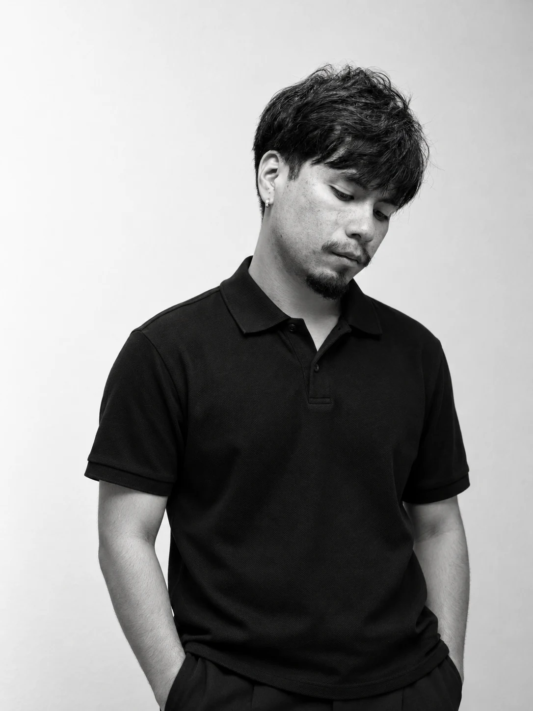 Black-and-white standing portrait of Alexis Vacio